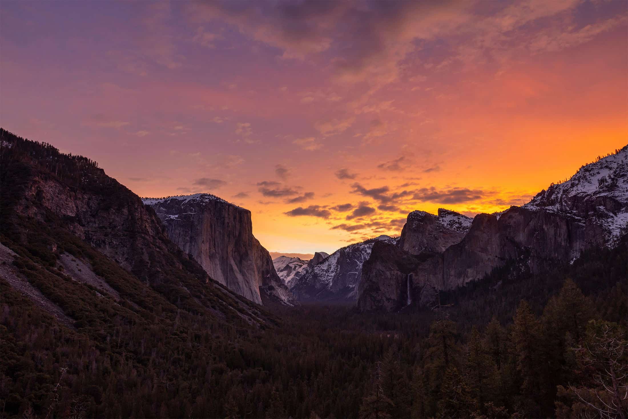 view of the mountains in front of a sunset